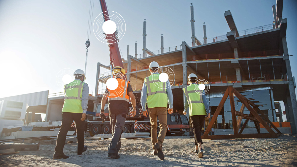 A picture of construction workers wearing the TokenMe wearable technology on the jobsite Image Source: TokenMe