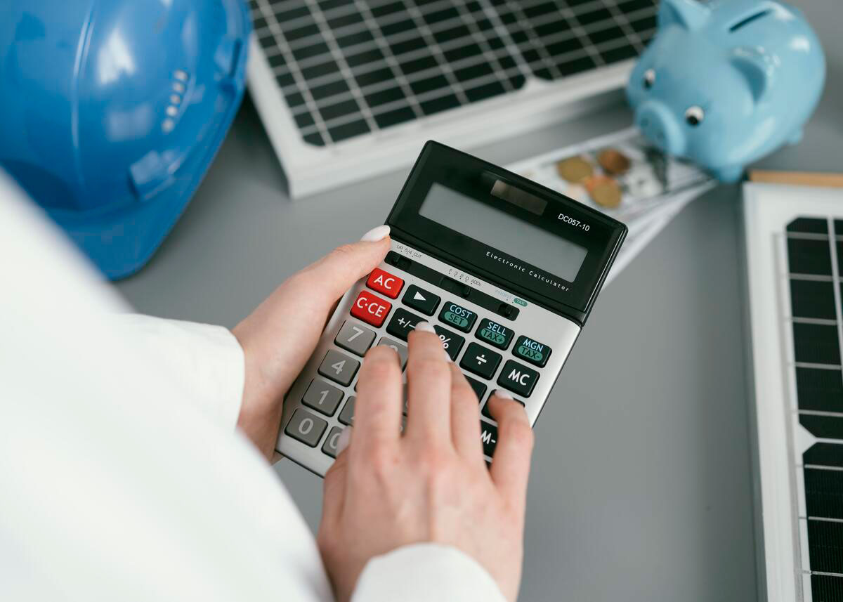 close-up-hand-holding-calculator-thinking-about-construction-budget-management