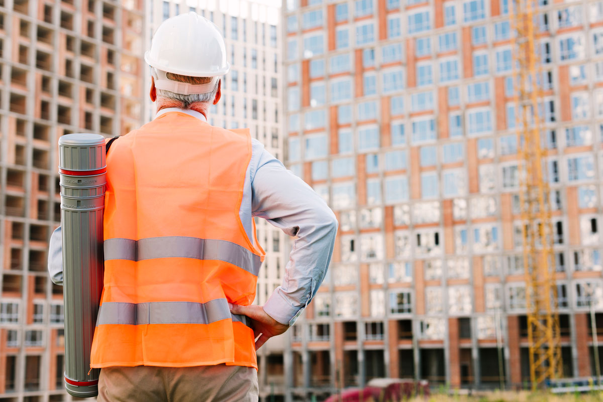 back-view-old-man-with-hand-hip-thinking-about-Construction-Statistics