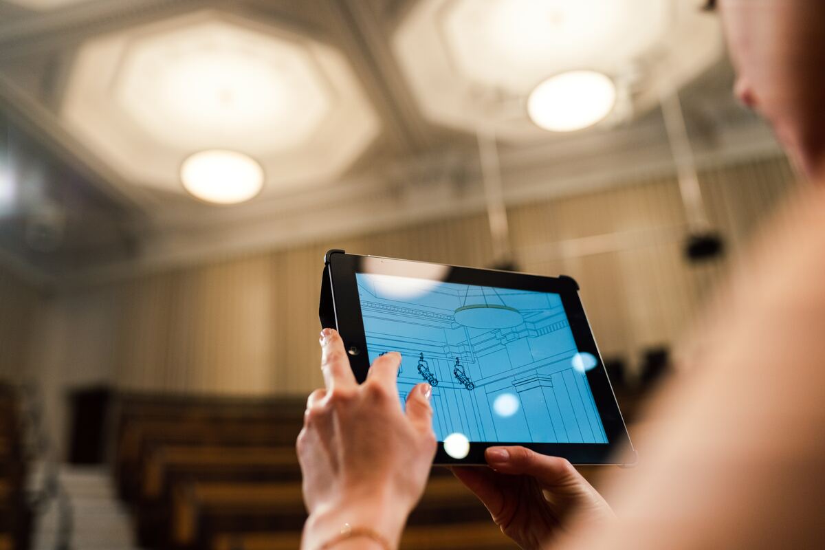 The-Person-Holding-a-Black-Tablet-Computer-Construction-AI-Software