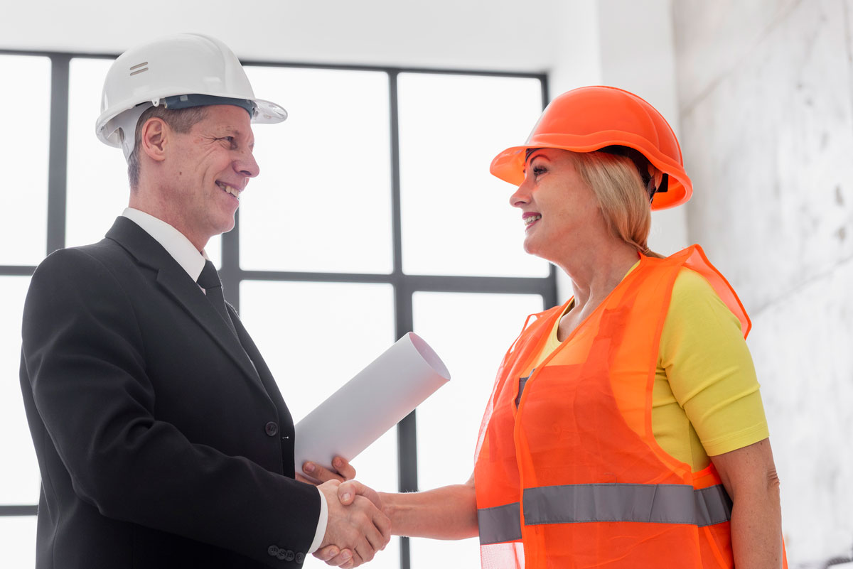 low-angle-business-hand-shake-on-change-order-in-construction