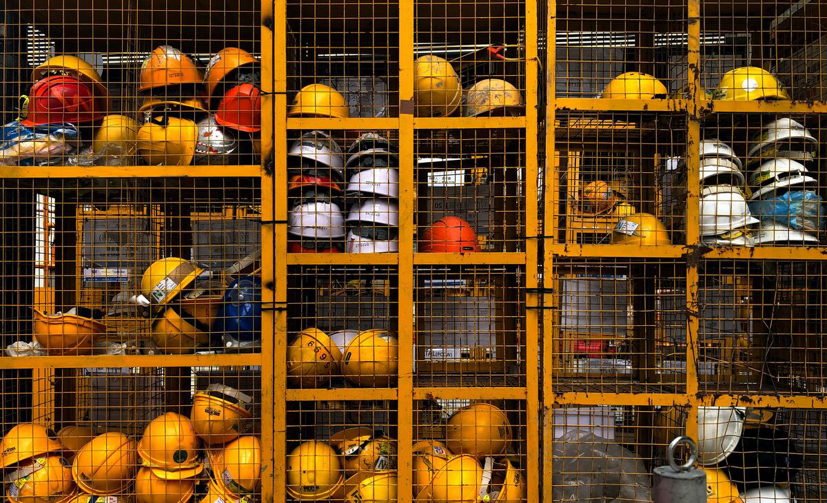 Construction-Site-Safety-with-helmets-orange-storage