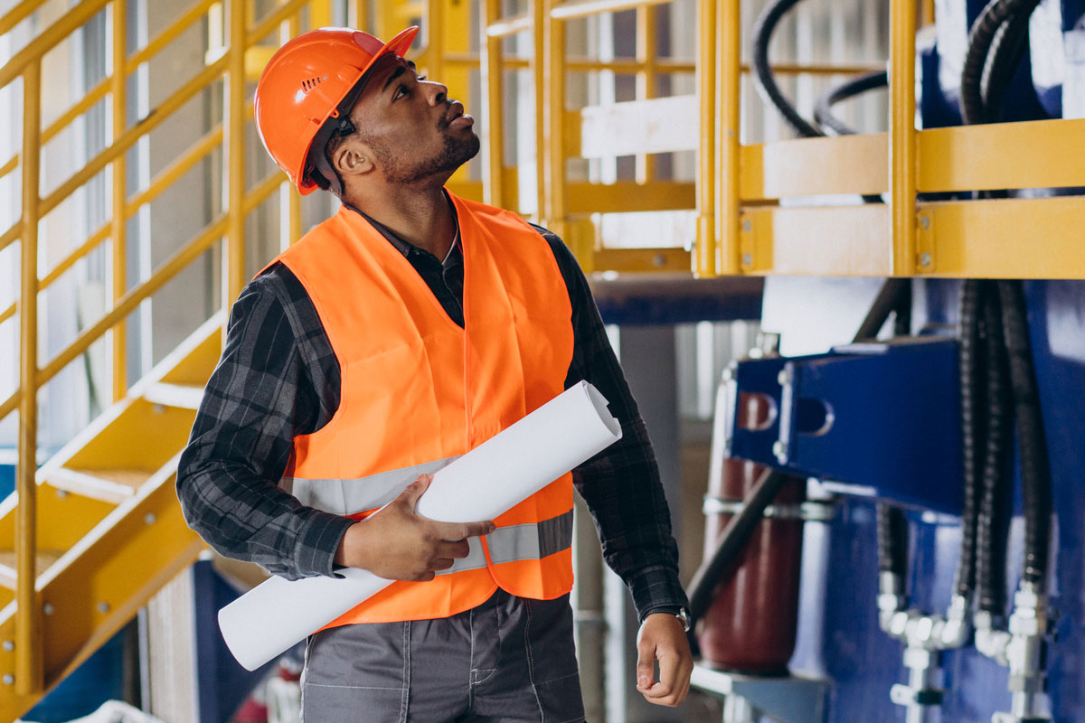 Construction-Site-Safety-worker-standing-uniform-wearing-safety-hat-factory