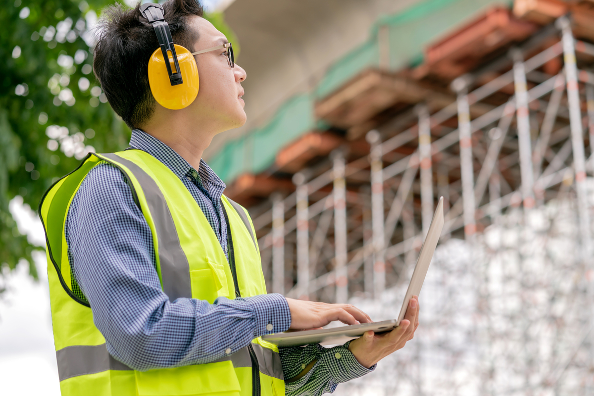 Engineer-working-on-Cybersecurity-in-Construction-with-laptop