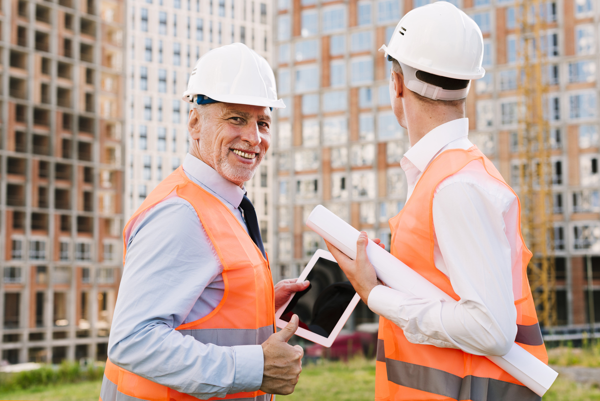 medium-shot-men-safety-vests-with-tablet-Digital-Transformation-Framework