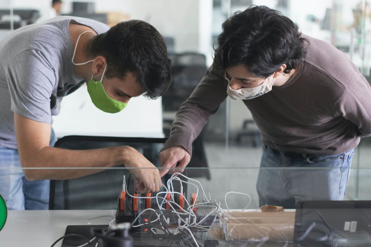 Man-in-Black-Long-Sleeve-Shirt-Holding-Clear-Glass-Bowl-Industrial-Internet-of-Things