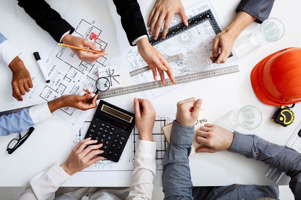 Businessmen-Hands-White-Table-With-Documents-Drafts-Construction-Process