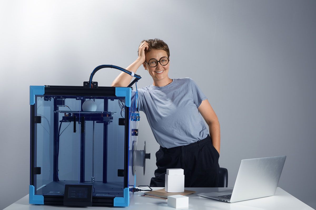 engineer-lady-glasses-smiling-near-3d-printing-machine-her-office-Sustainable-Construction-Technologies