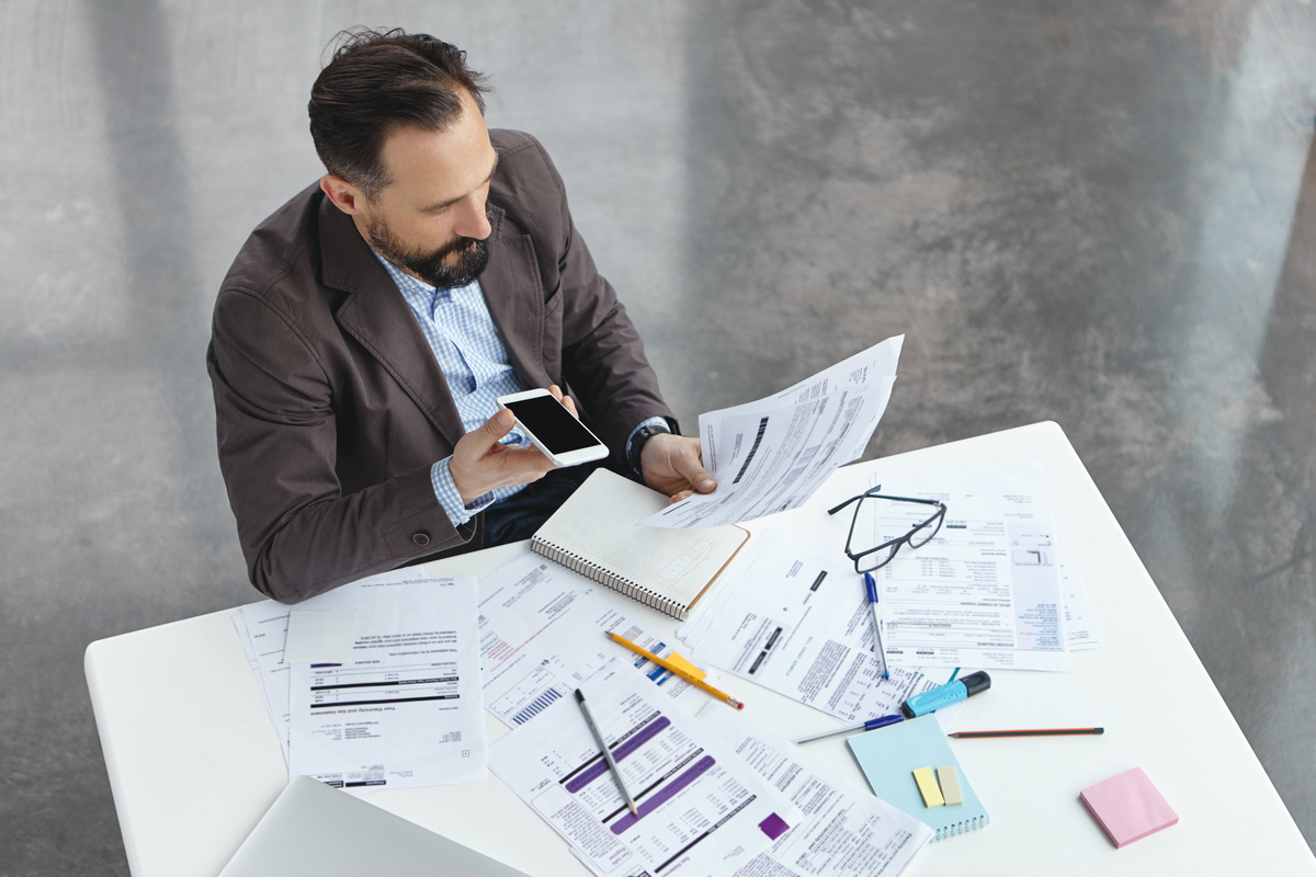 businessman-office-talking-about-construction-workflow-on-the-phone