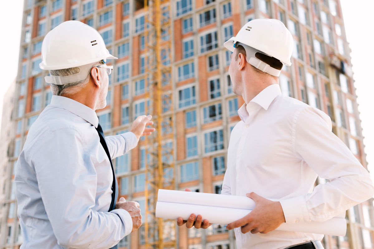 low-angle-people-with-helmets-looking-scaffolding-design-digital-twin