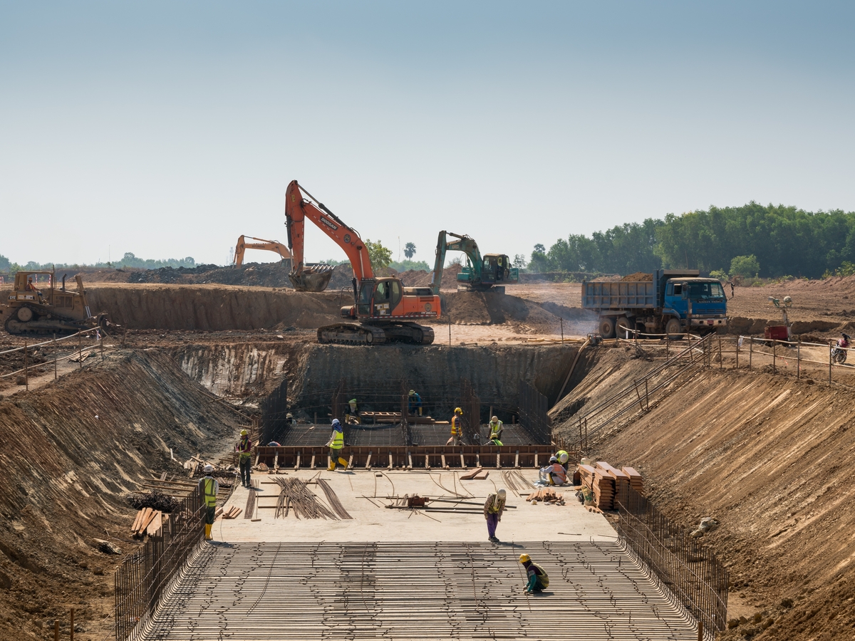 Heavy-Machines-and-Construction-Workers-Working-on-a-Building-Construction-Materials