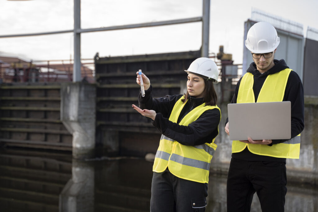 medium-shot-engineers-working-on-predictive-maintenance-in-buildings