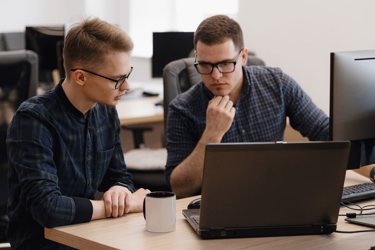 group-young-business-people-working-office-discussing-iot