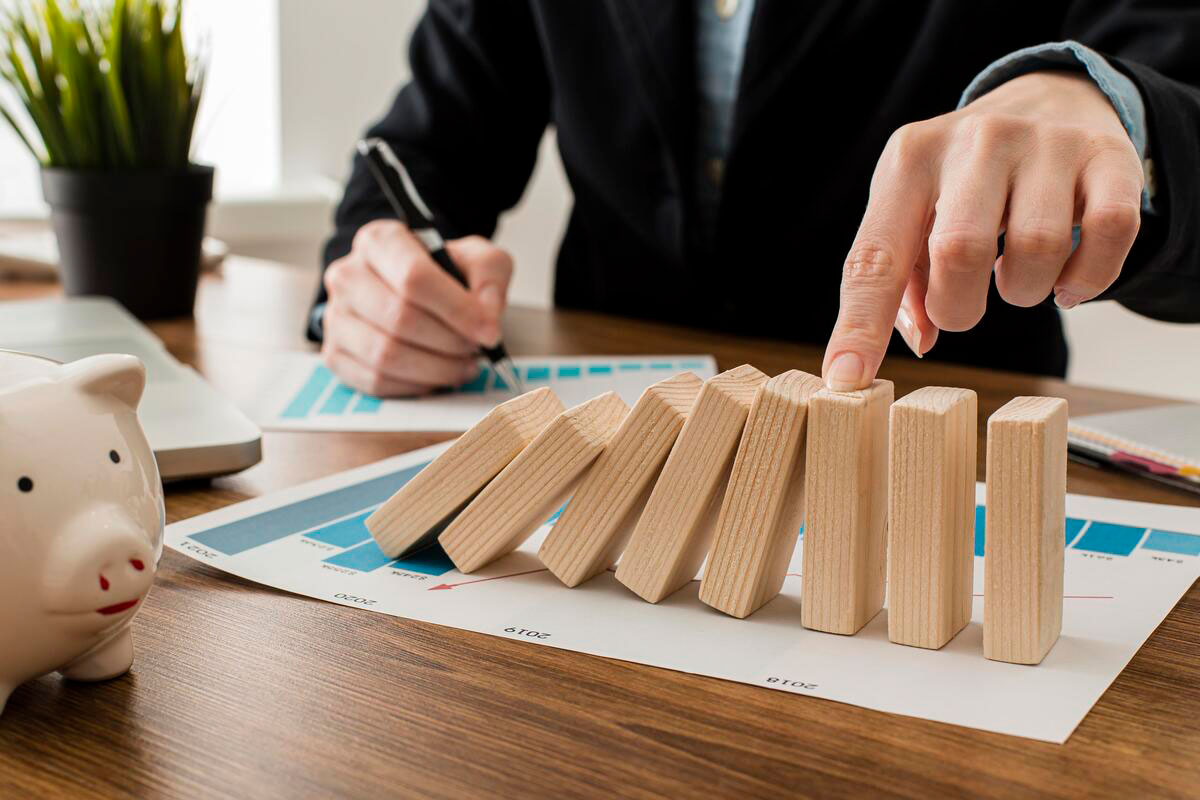 businessman-office-with-wooden-blocks-working-on-Risk-Management