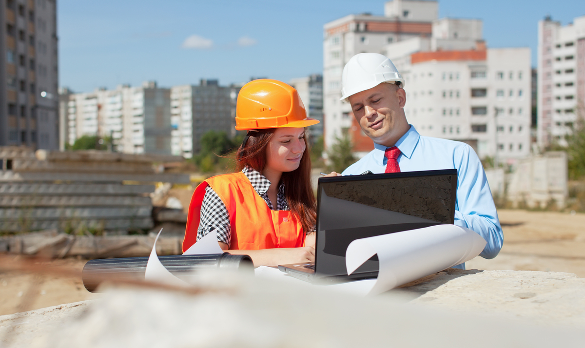 Two-Architects-In-Front-of-Building-Site-Submittal-in-Construction