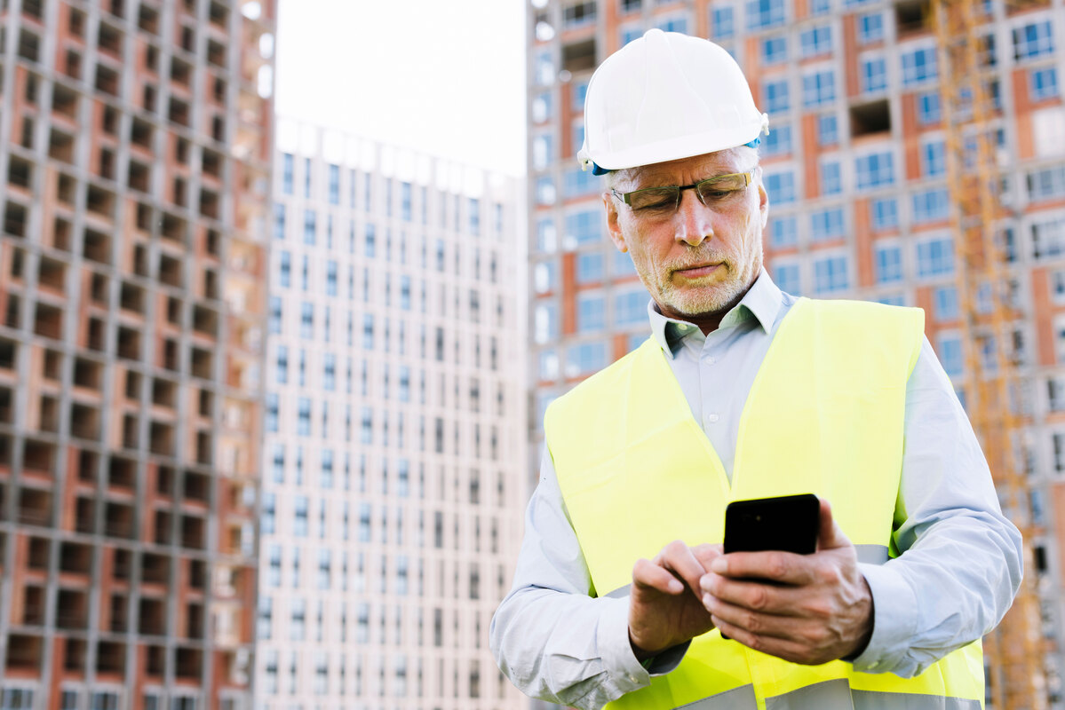 low-angle-old-man-looking-smartphone-Scan-to-BIM-Cost