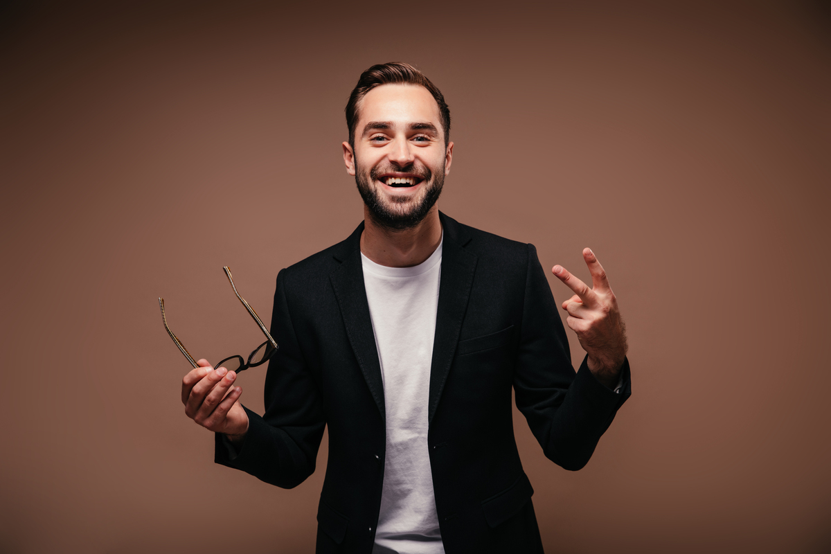 optimistic-man-black-jacket-holds-glasses-wining-construction-construction awards