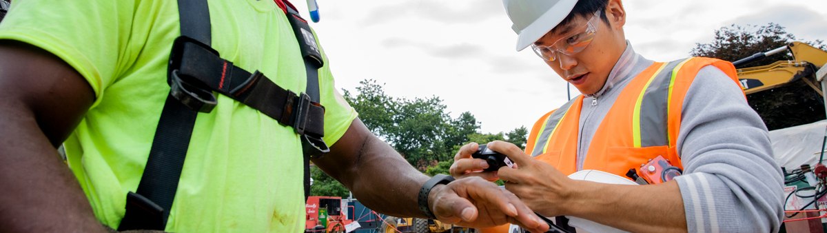 Engineer-installing-Types-of-Sensors-in-Construction-Industry-on-worker-in-construction-site