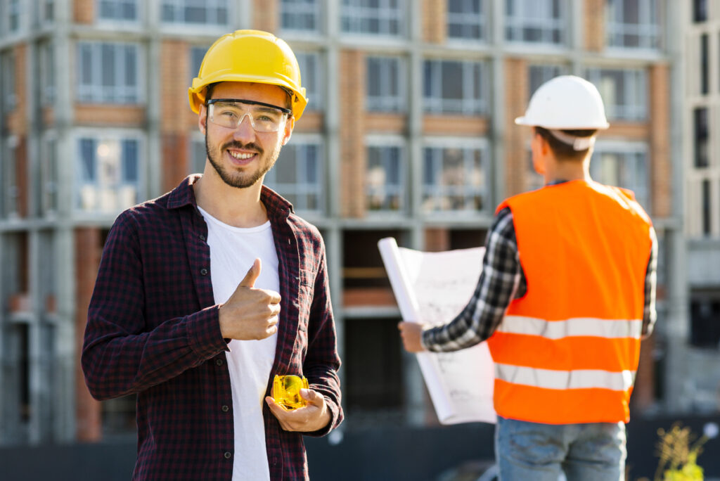 medium-shot-portrait-smiling-architect-looking-camera-Construction-Terms