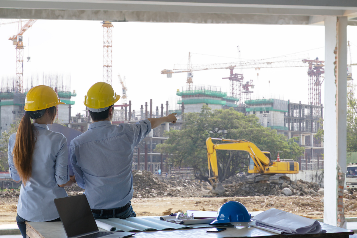 engineer-group-worker-meeting-discussion-with-construction-blueprint-site-work-point-finger-work-site-Construction-Company-in-Canada