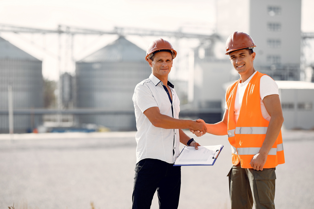 engineers-helmets-standing-by-factory-Construction-Company-in-Dubai