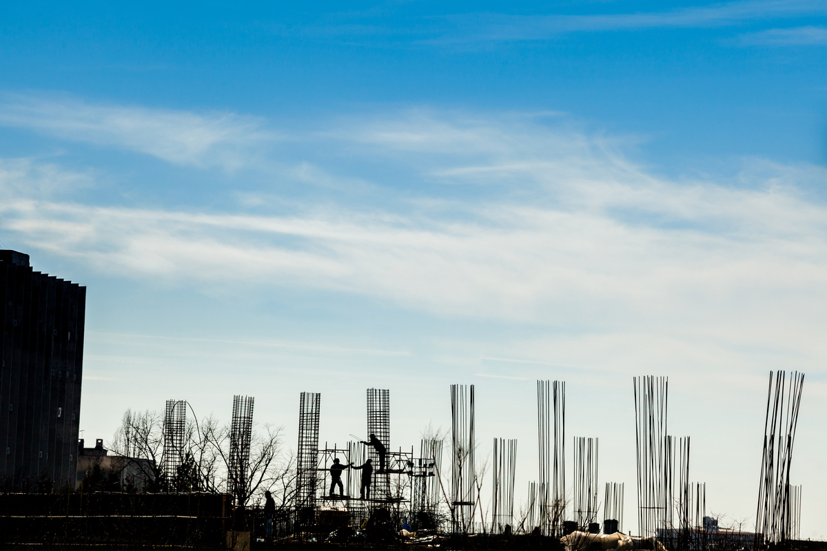 silhouette-construction-workers-yard-Construction-Company-in-Saudi-Arabia