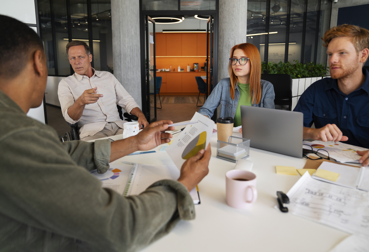 man-wheelchair-having-inclusive-office-job-Change-Management-Examples