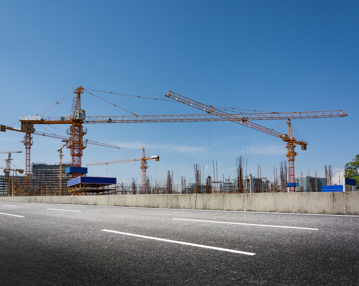 construction-site-with-cranes-against-blue-sky-Change-Management-in-Construction