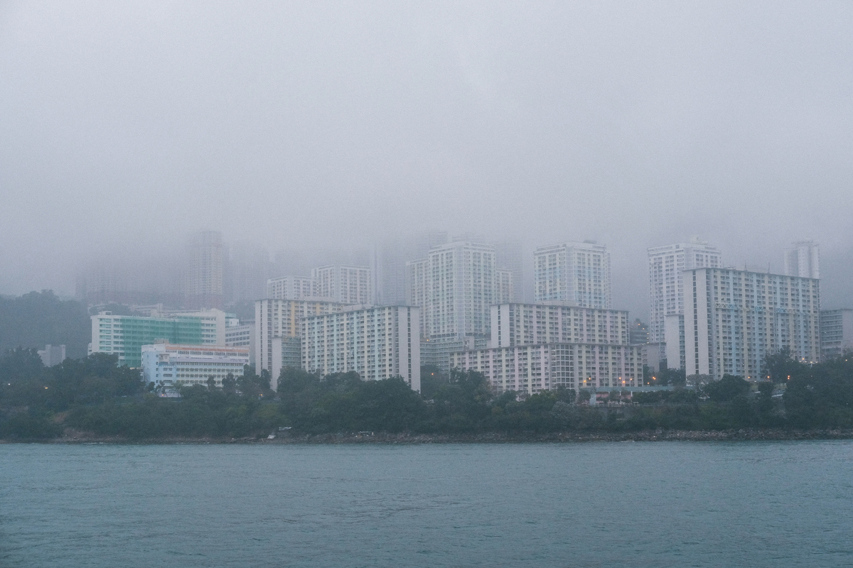 grey-concrete-high-skyscrapers-coast-foggy-weather-Climate-Change-Impact-on-Buildings