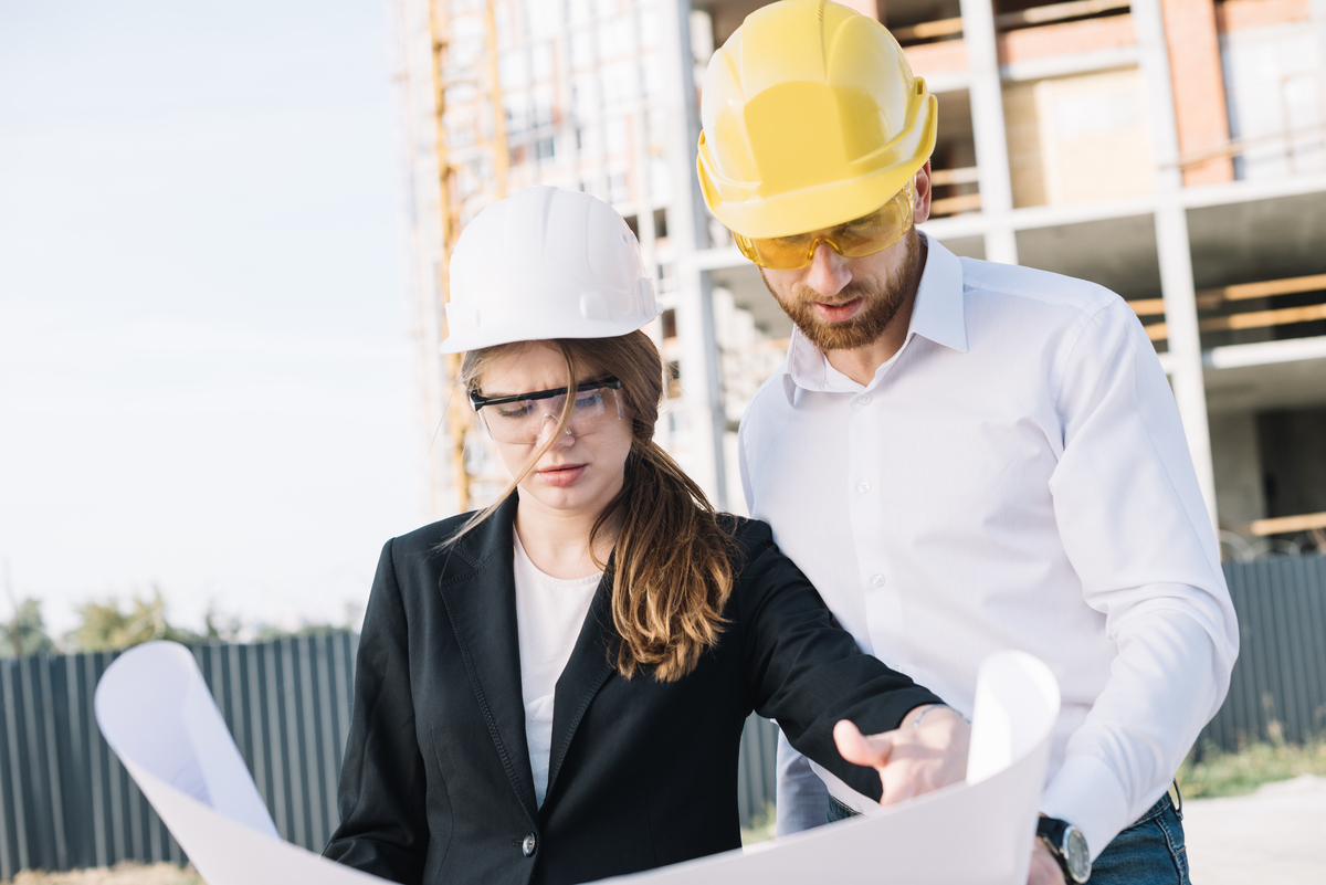 man-woman-studying-draft-Construction-Company-in-Sweden