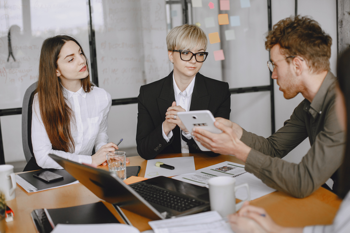 people-are-working-project-man-women-suits-sitting-table-businessmen-use-laptop-Organizational-Change-Management